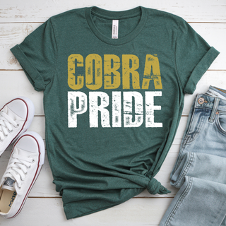 Heather forest green tee with distressed gold COBRA and white PRIDE stacked text, flat lay with white sneakers and jeans