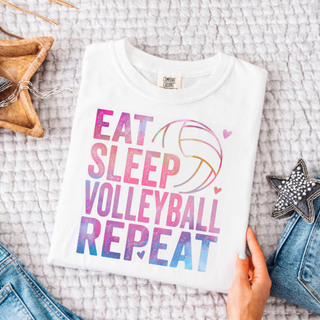 Eat Sleep Volleyball Repeat Graphic Top in white with pink purple blue watercolor Eat Sleep Volleyball Repeat lettering and volleyball design
