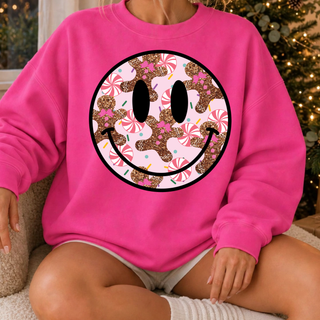 Faux-sequin-look Christmas smiley face design with gingerbread, peppermint candies, pink bows, and sprinkles on a hot pink top