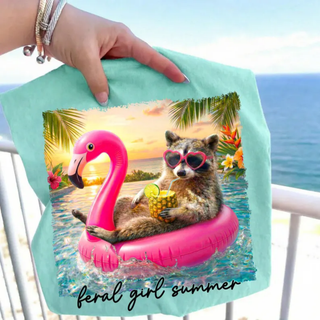 Chalky mint Comfort Colors graphic tee with raccoon flamingo float tropical design front view
