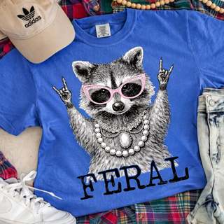 Flo blue Comfort Colors tee with Feral raccoon wearing pink sunglasses and pearl necklace graphic
