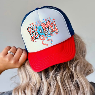 Woman wearing white rich red true royal trucker hat with firecracker doodle mama patterned letters red white blue stars bows
