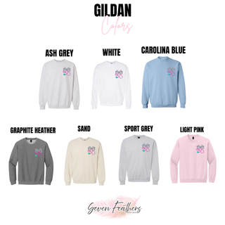 Gildan crewnecks in ash grey, white, carolina blue, graphite heather, sand, sport grey, and light pink with floral bow stethoscope pocket design
