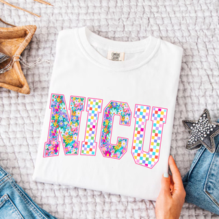 Floral Checkered NICU Graphic Top in white with colorful floral and rainbow checkered NICU block letter design
