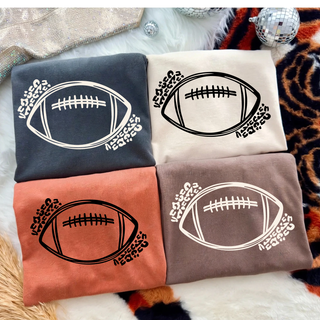 Comfort Colors tees in pepper, ivory, yam, and espresso with football sketch and leopard print swirl graphic
