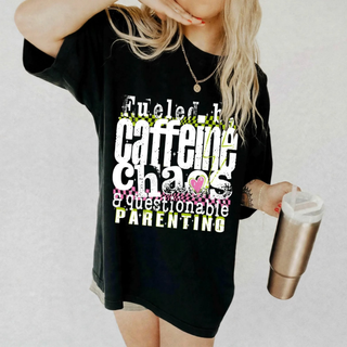 Fueled by Caffeine Chaos and Questionable Parenting graphic tee on a model
