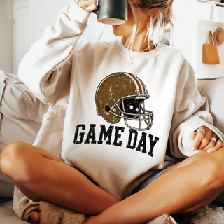 Woman wearing cream Game Day football helmet crewneck sweatshirt
