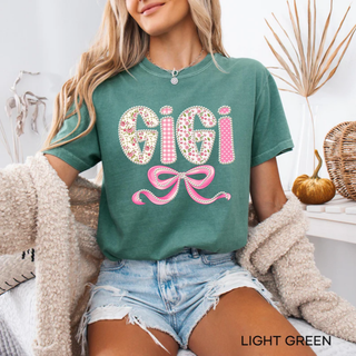 Light green Comfort Colors tee with Gigi floral gingham polka dot pearl lettering and pink bow design front view