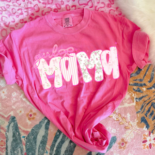 Neon pink graphic tee laid flat with white girl mama floral stripe and bow patterned letter design on pink patterned background