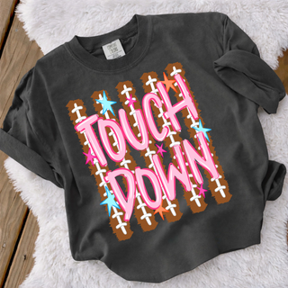 Black girly touchdown football tee with pink bubble lettering and football lace print background
