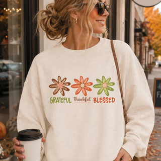 Grateful Thankful Blessed design with three hand-drawn florals in brown, rust, and green lettering