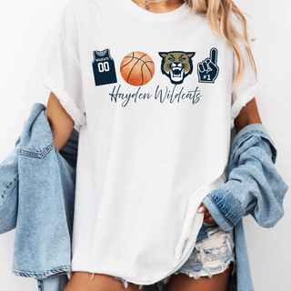 White t-shirt with Hayden Wildcats basketball icon design featuring a navy jersey icon reading Wildcats 00, a watercolor basketball, a wildcat mascot head icon, and a number 1 foam finger icon above Hayden Wildcats in navy script