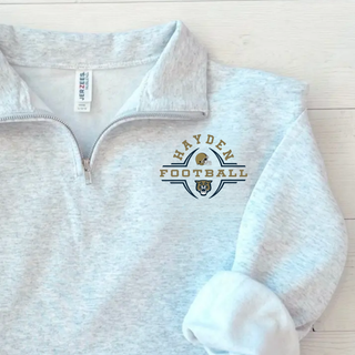 Hayden Wildcats Football Helmet Crest Quarter Zip Pullover - Ash grey Jerzees lifestyle flat lay
