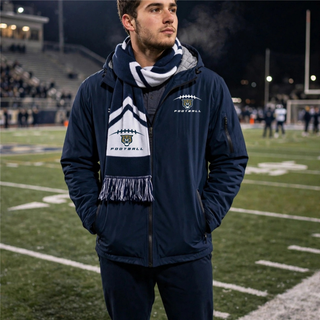 Man wearing navy and white Hayden Wildcats football laces game day scarf on football field Topeka Kansas

