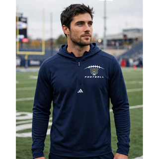 Man wearing navy Hayden Wildcats football laces quarter-zip hooded pullover on football field Topeka Kansas
