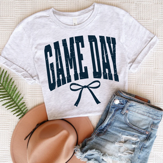 Topeka Hayden Wildcats game day navy distressed top with bow graphic styled with denim shorts and a hat
