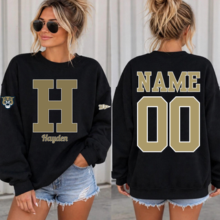 Woman wearing a black personalized Hayden Wildcats crewneck sweatshirt with an H initial and name on the front and a name and number on the back