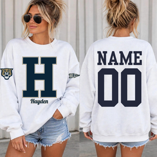 Woman wearing a white personalized Hayden Wildcats crewneck sweatshirt with an H initial and name on the front and a name and number on the back