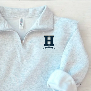 Ash grey Jerzees quarter-zip pullover with Hayden Wildcats Pocket H Football left chest H logo with football laces detail
