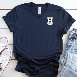 Navy Bella Canvas tee with Hayden Wildcats Pocket H Football Top design featuring left chest H logo with football laces detail