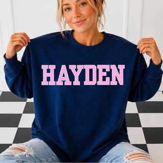 Hayden Wildcats Polka Dot Top featuring a pink polka dot HAYDEN wordmark on a navy crewneck
