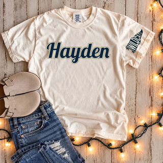 Hayden Wildcats Script Graphic Sleeve Print Top - cream shirt with navy Hayden script wordmark and Wildcats pennant flag sleeve print