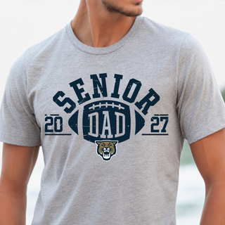 Man wearing Hayden Wildcats Senior Dad 2027 top in ash grey with football and wildcat logo graphic
