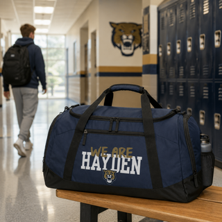 Navy Hayden Wildcats we are hayden duffle bag on bench in school locker room Topeka Kansas
