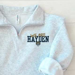 Ash grey Hayden Wildcats we are hayden quarter zip pullover with gold script overlay, bold block hayden text, and wildcat mascot on left chest
