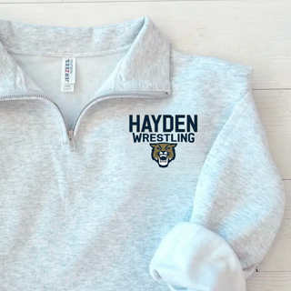 Ash grey Jerzees cadet quarter-zip flat lay close-up showing the Hayden Wrestling lettering and cougar mascot head logo on the left chest