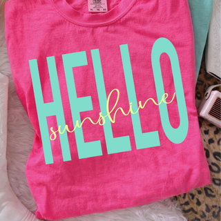 Neon pink Comfort Colors tee with oversized bold Hello Sunshine script front view