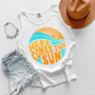 Here Comes the Sun Graphic Tank in white with retro orange sun teal waves and bold Here Comes the Sun lettering
