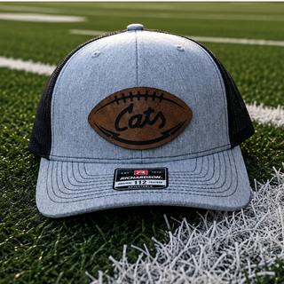 Holton Wildcats football-shaped leather patch Richardson 112 hat with script Cats lettering