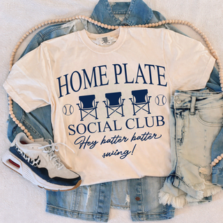 White Comfort Colors tee flat lay with HOME PLATE SOCIAL CLUB Hey batter batter swing baseball chair design in navy
