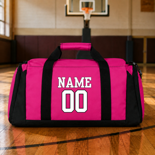 Hype Basketball Duffel Bag in pink and black showing name and number personalization on the side