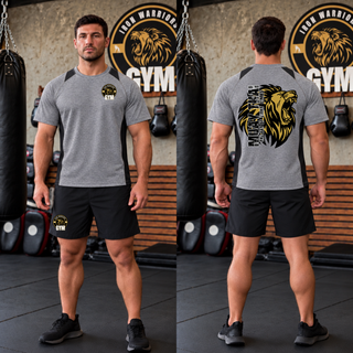 Model wearing the Iron Warriors Gym Art of Eight Limbs Colorblock Contender Tee, heather grey with black panels, front lion crest and back gold lion head with Muay Thai lettering