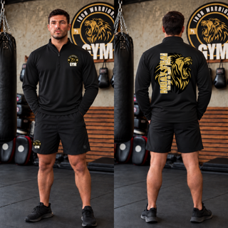 Model wearing the Iron Warriors Gym Art of Eight Limbs PosiCharge Quarter-Zip in Black, front lion crest and back gold lion head with Muay Thai lettering