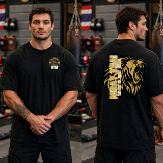 Man in a black tee with the lion crest on the chest and a roaring gold lion with Muay Thai The Art of Eight Limbs on the back