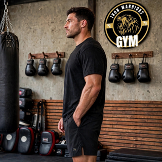 Side view of black Barrage stretch woven training shorts with the Iron Warriors Gym logo on the leg.