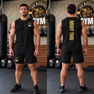 Man in a black sleeveless competitor tank in a gym, shown from the front with the Iron Warriors Gym lion crest on the left chest and from the back with Muay Thai in gold vertical lettering