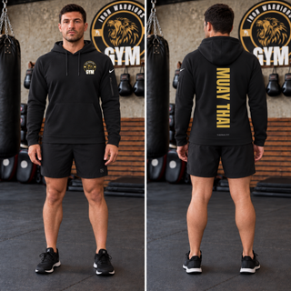 Man in a black pocket pullover hoodie with the Iron Warriors Gym lion crest on the left chest, front and back views showing Muay Thai in gold vertical lettering