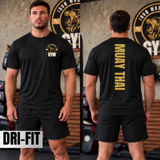 Man in a black performance top in a gym with the Iron Warriors Gym lion crest on the left chest, shown from the front and the back with Muay Thai in gold vertical lettering