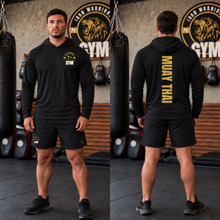 Man in a black PosiCharge hooded pullover and black shorts in a gym, shown from the front and the back with Muay Thai in gold vertical lettering
