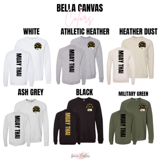 Bella Canvas color chart showing White, Athletic Heather, Heather Dust, Ash Grey, Black, and Military Green crewnecks with the lion crest on the front and vertical Muay Thai on the back
