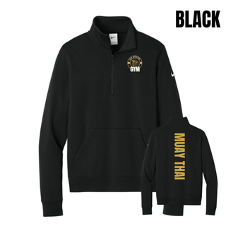 Black fleece half-zip flat lay with the Iron Warriors Gym lion crest on the left chest and Muay Thai in gold vertical lettering on the back