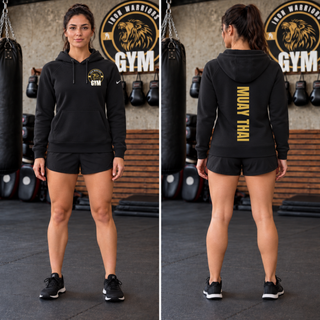 Woman in a black fleece pullover hoodie with the Iron Warriors Gym lion crest on the left chest, front and back views showing Muay Thai in gold vertical lettering