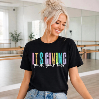 Woman wearing black top with colorful it's giving point your toes dance graphic