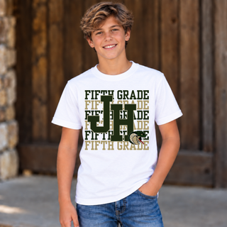 Boy modeling Jackson Heights Cobras Fifth Grade Stacked Top in white with stacked FIFTH GRADE text, JH monogram, and cobra head icon