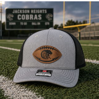 Jackson Heights Cobras football trucker hat with football shaped leather patch laser engraved with coiled cobra snake and lightning bolts on Richardson 112 snapback
