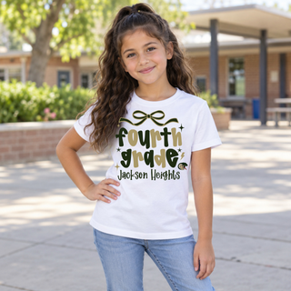 Jackson Heights Cobras Fourth Grade Bow Top modeled on a girl, white tee with bow accent and fourth grade Jackson Heights design